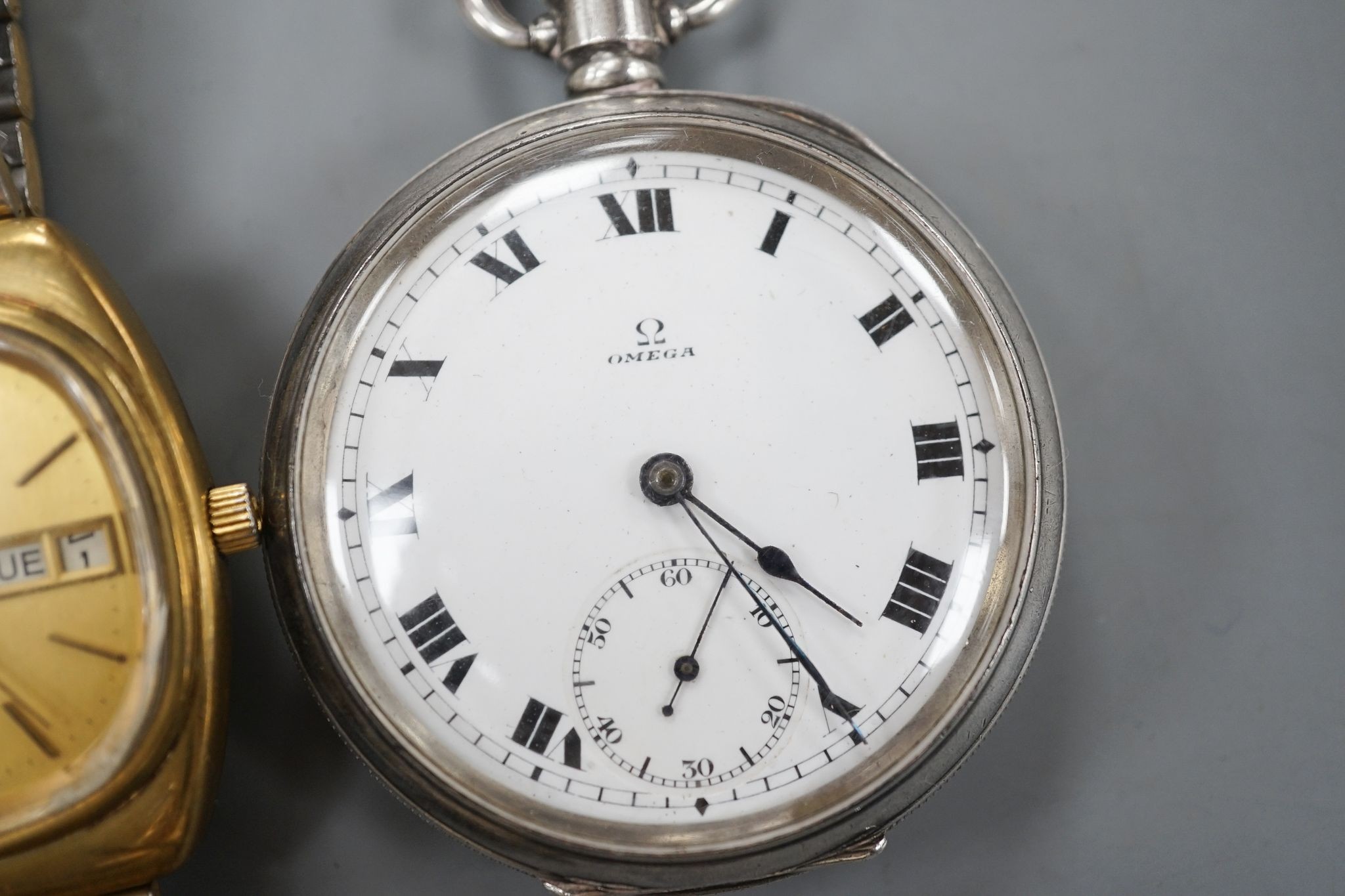 A George V silver Omega open face keyless pocket watch and a gold plated Omega Seamaster day/date automatic wrist watch.